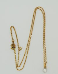 Lot 44 - Chaine et pendentif serti d'un diamant