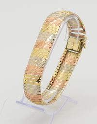 Lot 04 - Bracelet articulé trois ors