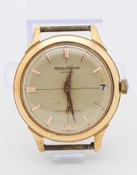 Vintage gold-tone Jaeger-LeCoultre automatic wristwatch with date display at 3 o'clock and dial patina