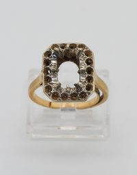 Gold ring with a square halo setting, brown stones surrounding an empty center.