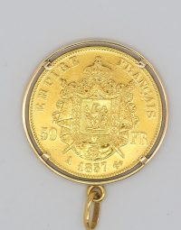 Gold French Empire coin pendant featuring a coat of arms, with the inscription 'EMPIRE FRANCAIS' and '50 FR', date '1857', and a hanging ring at the bottom.